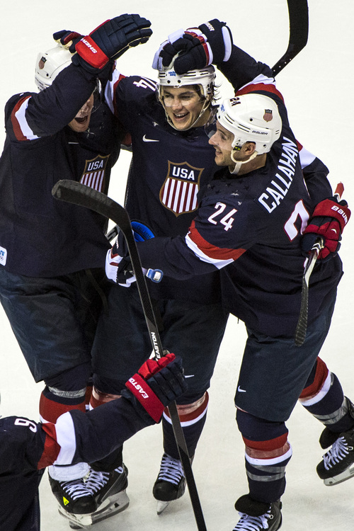 SOCHI, RUSSIA  - JANUARY 15:
United States' T.J. Oshie celebrates with his teammates Paul Stastny (26) and Ryan Callahan (24) after winning the game in an overtime shootout against Russia at Bolshoy Ice Dome during the 2014 Sochi Olympics Saturday February 15, 2014. 
The United States men's hockey team defeated Russia with a 3-2 overtime victory.
(Photo by Chris Detrick/The Salt Lake Tribune)