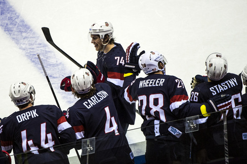 SOCHI, RUSSIA  - JANUARY 15:
United States' T.J. Oshie celebrates with his teammates after scoring a shootout goal in overtime against Russia at Bolshoy Ice Dome during the 2014 Sochi Olympics Saturday February 15, 2014. 
The United States men's hockey team defeated Russia with a 3-2 overtime victory.
(Photo by Chris Detrick/The Salt Lake Tribune)