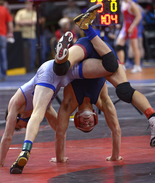 Leah Hogsten  |  The Salt Lake Tribune
Jaydon Rogers of Fremont High School defeated Jaron Jensen of Herriman High School during their 5A, 132lb. matchup at the state wrestling tournament semifinal round Friday, February 14, 2014 at the Maverik Center.