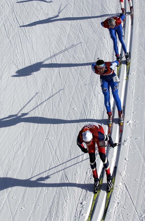Trent Nelson  |  Tribune file photo
Norway's Anders Aukland, followed closely by Italian Fabio Maj during the men's 4x10km race during the 2002 Winter Olympics.