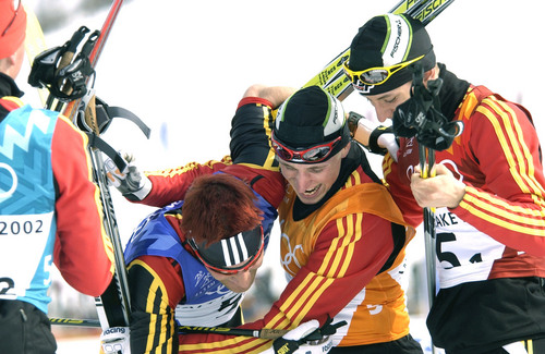 Al Hartmann  |  Tribune file photo
Four members of the German Nordic combined 4x5km relay team celebrate together at the finish line during the 2002 Winter Olympics.