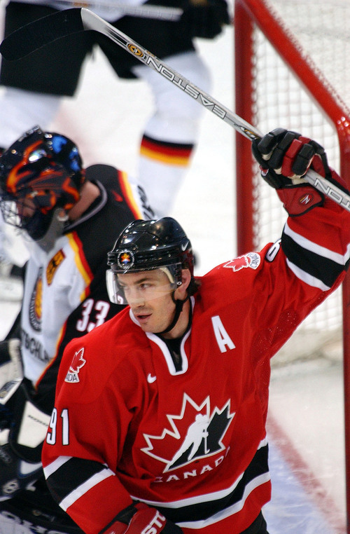 Danny La | Tribune file photo
Canada's Joe Sakic (91) raises his arm after scoring a 2nd period goal vs. germany during the 2002 Winter Olympics.