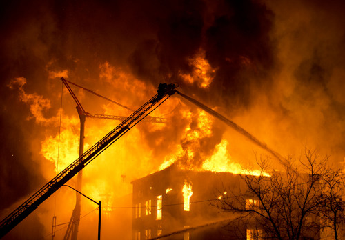 Lennie Mahler  |  The Salt Lake Tribune
Firefighters battle a four-alarm fire near downtown Salt Lake City, Sunday, Feb. 9, 2014.