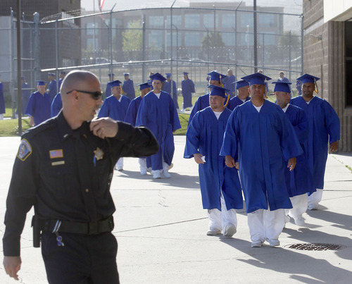 Al Hartmann  |  The Salt Lake Tribune
A record-high 360 men and women inmates line up for their high school graduation procession at the Draper prison in June 2013 to celebrate an important milestone on their paths toward returning to the community as law-abiding citizens.
