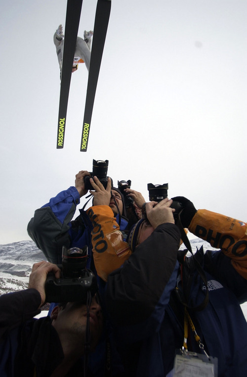 Trent Nelson | Tribune file photo
Photographers positioned under the in-run of the K120 ski jump hill during the men's ski jumping K120 team competition at the 2002 Winter Olympics.