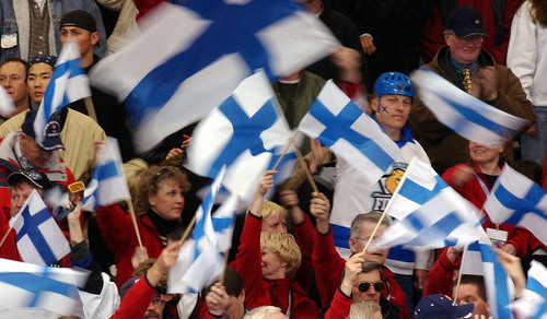 Danny La  |  Tribune file photo
Fans of Team Finland fly the country's flag at the Russia vs. Finland men's hockey game during the 2002 Winter Olympics.