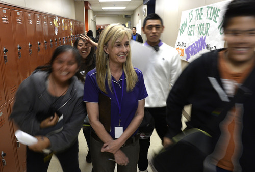 Rick Egan  | The Salt Lake Tribune 

Students rush past Monument Valley High Principal Sylvia McMillan during lunch at the school on Thursday, January 30, 2014.