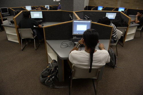 Rick Egan  | The Salt Lake Tribune 

Remington Begay, a senior at Monument Valley High School, works on a computer at the school on Thursday, January 30, 2014.