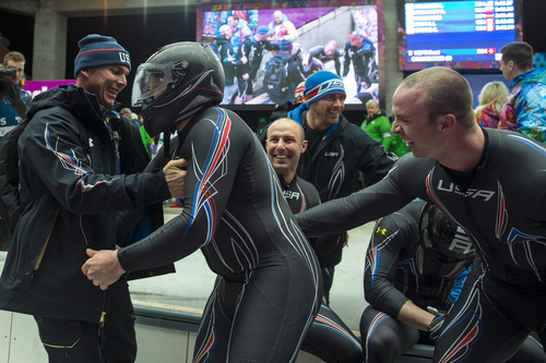 KRASNAYA POLYANA, RUSSIA  - JANUARY 17:
USA bobsled Head Coach Brian Shimer, left, congratulates pilot Steven Holcomb, with helmet, as Nick Cunningham, back center, Cory Butner, back right, and Dallas Robinson, front right, celebrate with brakeman Steven Langton, back right, after competing in the men's two-man bobsled at Sanki Sliding Center during the 2014 Sochi Olympics Monday February 17, 2014. USA-1 with Steven Holcomb, of Park City, Utah, and Steve Langton, of Melrose, Mass., won the bronze medal with a time of 3:46.27.
(Photo by Chris Detrick/The Salt Lake Tribune)