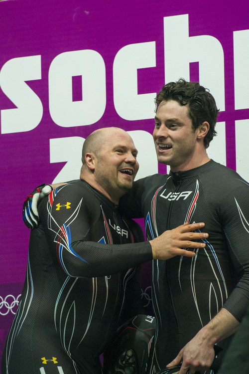 KRASNAYA POLYANA, RUSSIA  - JANUARY 17:
Pilot Steven Holcomb, left, and brakeman Steven Langton, celebrate after competing in the men's two-man bobsled at Sanki Sliding Center during the 2014 Sochi Olympics Monday February 17, 2014. USA-1 with Steven Holcomb, of Park City, Utah, and Steve Langton, of Melrose, Mass., won the bronze medal with a time of 3:46.27.
(Photo by Chris Detrick/The Salt Lake Tribune)