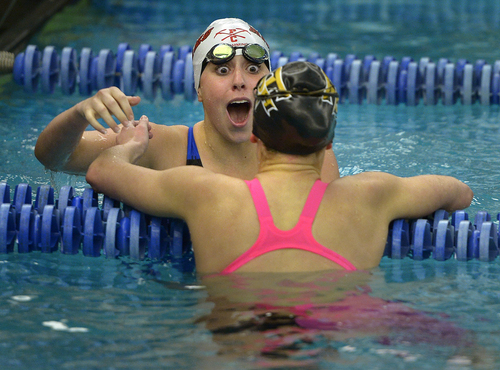 Scott Sommerdorf   |  The Salt Lake Tribune
Park City's Mara Selznick reacts with surprise as she goes to hug Amelia Draney of Desert Hills after anchoring the winning Park City effort in the women's 400 yard freestyle relay. Both Park City and Desert Hills beat the existing state record for the event. Park City won with a time of 3:38.06, while Desert Hills, anchored by Draney placed second at 3:39.56, beating the old record of 3:41.52, at the 3A state swim meet in the Richards Building at BYU, Saturday, Feb. 15, 2014.