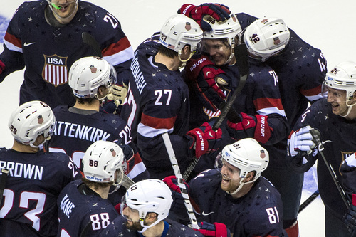SOCHI, RUSSIA  - JANUARY 15:
United States' T.J. Oshie (74) celebrates with Ryan McDonagh (27) and  David Backes (42) and their other teammates after winning the game in an overtime shootout against Russia at Bolshoy Ice Dome during the 2014 Sochi Olympics Saturday February 15, 2014. 
The United States men's hockey team defeated Russia with a 3-2 overtime victory.
(Photo by Chris Detrick/The Salt Lake Tribune)