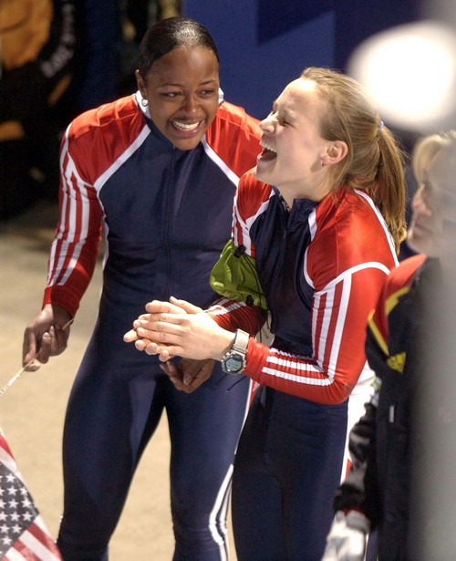 Trent Nelson | Tribune file photo
USA gold medalists Jill Bakken (right) and Vonetta Flowers celebrate their gold medal in the women's bobsled during the 2002 Winter Olympics.