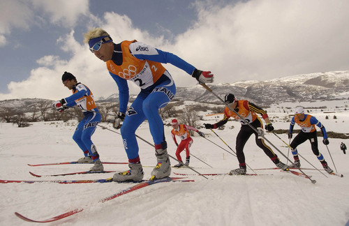 Francisco Kjolseth | Tribune file photo
Cristian Zorzi of Italy, foreground, leads the pack up the hill in the semi-final of the men's sprint at Soldier Hollow during the 2002 Winter Olympics.