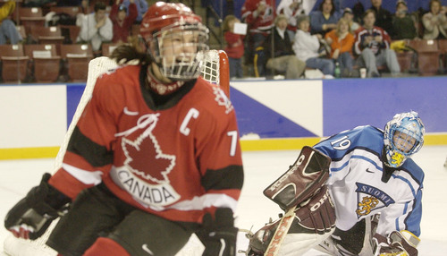 Ryan Galbraith | Tribune file photo
Findland's goalkeeper Tuula Puputti watches as Canada's Cassie Campbell cheers after she scored Canada's sixth goal during the 2002 Winter Olympics.