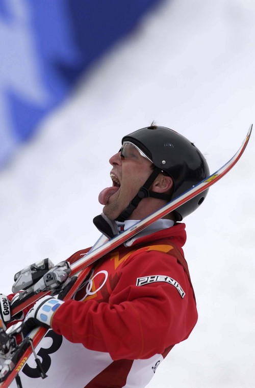 Trent Nelson | Tribune file photo
USA silver medalist Joe Pack clowns for the fans after winning his medal in the men's aerials final at the 2002 Olympic Winter Games.