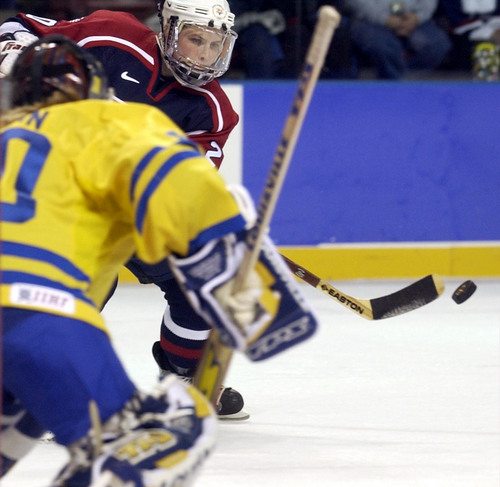 Ryan Galbraith | Tribune file photo
USA's Katie King takes a shot on Sweden's goalkeeper Kim Martin during their game at the 2002 Winter Olympics.