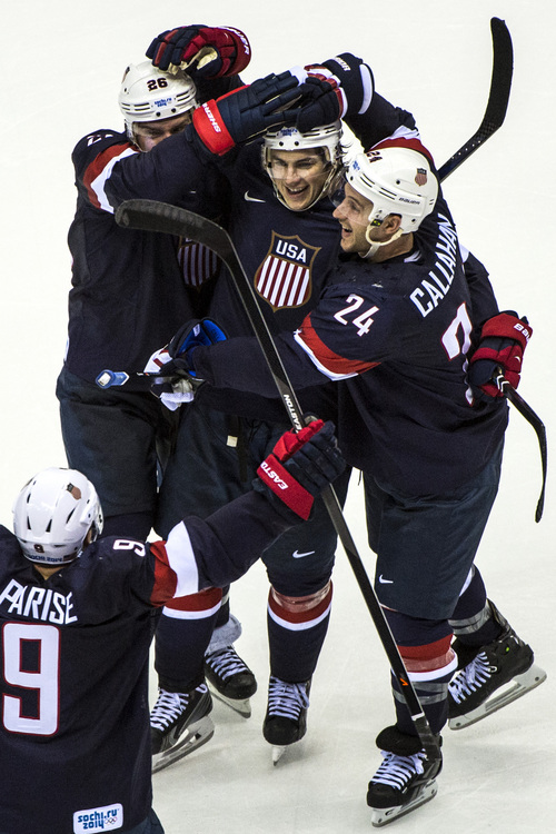 SOCHI, RUSSIA  - JANUARY 15:
United States' T.J. Oshie celebrates with his teammates Paul Stastny (26) Ryan Callahan (24) and Zach Parise (9) after winning the game in an overtime shootout against Russia at Bolshoy Ice Dome during the 2014 Sochi Olympics Saturday February 15, 2014. 
The United States men's hockey team defeated Russia with a 3-2 overtime victory.
(Photo by Chris Detrick/The Salt Lake Tribune)
