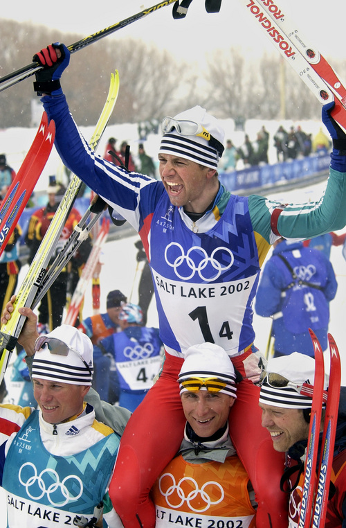Al Hartmann | Tribune file photo
The Norwegian 4x7.5K relay team, (l to r) Frode Andresen, Egil Gjelland and Halvard Hanevold, hold up Ole Einar Bjoerndalen at the finish line after winning gold in the event at Soldier Hollow during the 2002 Winter Olympics.