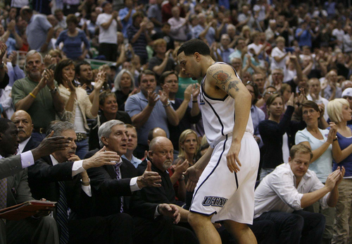 Salt Lake City - Fans cheer and applaud Utah Jazz guard Deron Williams (8) as he leaves the game late in the fourth quarter. Utah Jazz vs. Houston Rockets, game 4, 1st round NBA Playoffs. 
The Salt Lake Tribune/Trent Nelson; 4.28.2007