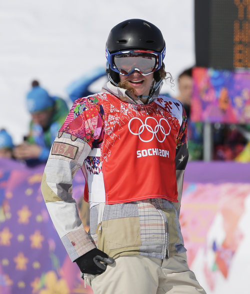 Lindsey Jacobellis  of the United States reacts after crashing in the second semifinal of the women's snowboard cross at the Rosa Khutor Extreme Park, at the 2014 Winter Olympics, Sunday, Feb. 16, 2014, in Krasnaya Polyana, Russia. (AP Photo/Andy Wong)