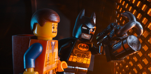 This image released by Warner Bros. Pictures shows characters Emmet, voiced by Chris Pratt, left, and Batman, voiced by Will Arnett, in a scene from "The Lego Movie." (AP Photo/Warner Bros. Pictures)
