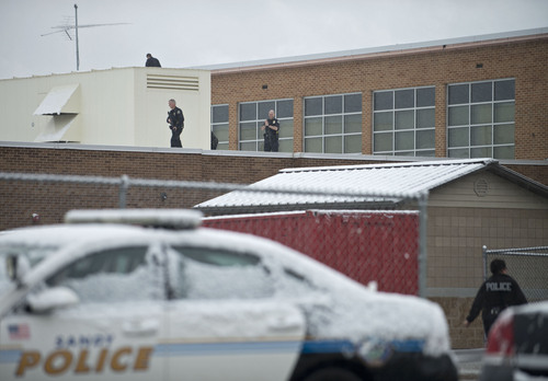 Lennie Mahler  |  The Salt Lake Tribune
Police search Sandy Elementary School for a burglary suspect as the school was on lockdown Wednesday, Feb. 19, 2014. Multiple parents had heard word of a bomb threat, which police did not confirm.