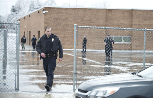 Lennie Mahler  |  The Salt Lake Tribune
Police search Sandy Elementary School for a burglary suspect as the school was on lockdown Wednesday, Feb. 19, 2014. Multiple parents had heard word of a bomb threat, which police did not confirm.