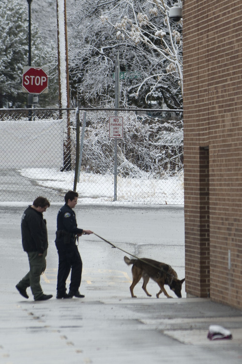 Lennie Mahler  |  The Salt Lake Tribune
Police K-9 units search Sandy Elementary School for a burglary suspect as the school was on lockdown Wednesday, Feb. 19, 2014. Multiple parents had heard word of a bomb threat, which police did not confirm.