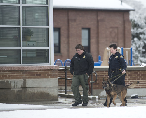 Lennie Mahler  |  The Salt Lake Tribune
Police K-9 units search Sandy Elementary School for a burglary suspect as the school was on lockdown Wednesday, Feb. 19, 2014. Multiple parents had heard word of a bomb threat, which police did not confirm.