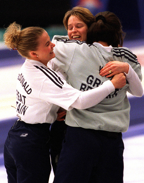 Grayson West  |  Tribune file photo

Fiona MacDonald, left, Janice Rankin, center, and Debbie Knox, right, embrace after defeating Switzerland to win the gold medal in curling at the Ice Sheet in Ogden.