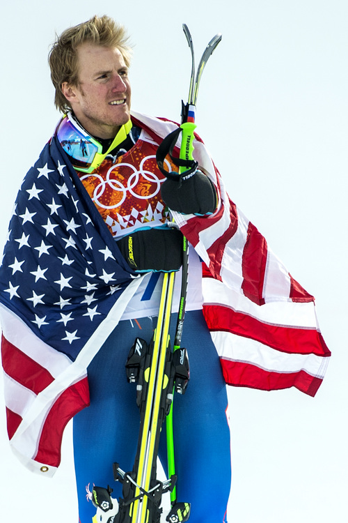 KRASNAYA POLYANA, RUSSIA  - JANUARY 19:
Ted Ligety, of Park City, celebrates with an American flag after winning the Men's Giant Slalom at Rosa Khutor Alpine Center during the 2014 Sochi Olympics Wednesday February 19, 2014. LIgety won the gold medal with a cumulative time of 2:45.29.
(Photo by Chris Detrick/The Salt Lake Tribune)