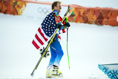 KRASNAYA POLYANA, RUSSIA  - JANUARY 19:
Ted Ligety, of Park City, celebrates with an American flag after winning the Men's Giant Slalom at Rosa Khutor Alpine Center during the 2014 Sochi Olympics Wednesday February 19, 2014. LIgety won the gold medal with a cumulative time of 2:45.29.
(Photo by Chris Detrick/The Salt Lake Tribune)