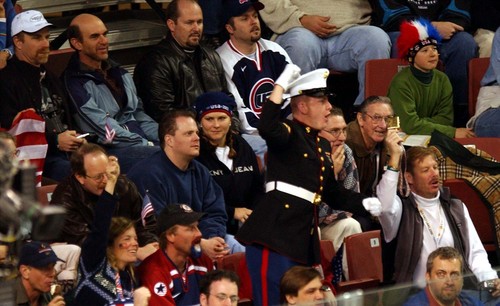 |  Tribune file photo
A spectator dressed in a United States Marine uniform tries to get the crowd excited by chanting "USA" during a men's hockey game at the 2002 Salt Lake Games.