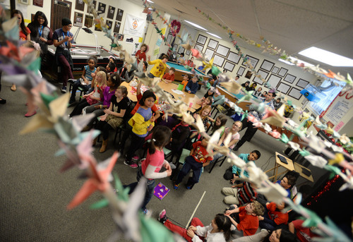 Steve Griffin  |  The Salt Lake Tribune

Paper cranes stretch across the ceiling at the Sandy Club, where children perform in a talent show. Sandy, Utah, Friday, February 14, 2014.