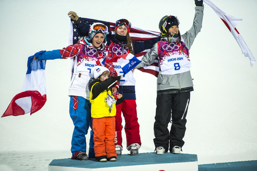 KRASNAYA POLYANA, RUSSIA  - JANUARY 20:
Maddie Bowman of the United States, center, celebrates after winning the gold medal in the women's ski halfpipe final, with silver medalist Marie Martinod of France, left, her daughter Meli Rose, 4, and bronze medalist Japan's Ayana Onozuka, right,  at Rosa Khutor Extreme Park during the 2014 Sochi Olympics Thursday February 20, 2014. Bowman won the gold medal with a score of 89.0.
(Photo by Chris Detrick/The Salt Lake Tribune)