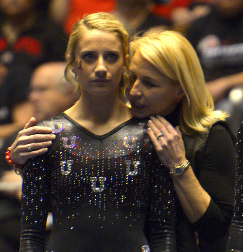 Rick Egan  | The Salt Lake Tribune 

Mary Beth Lofgren gets some last minute instructions from coach Megan Marsden, before she competes on the beam for the Utes, in Pac12 gymnastics competition, Utah vs. UCLA, at the Huntsman Center, Saturday, January 25, 2014.