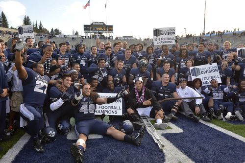 Chris Detrick  |  The Salt Lake Tribune
Members of the football team pose for pictures after the game at Merlin Olsen Field at Romney Stadium Saturday November 30, 2013.  Utah State defeated Wyoming 35-7. The Aggies will visit Fresno State in the title game next Saturday to complete their first season of MW competition.