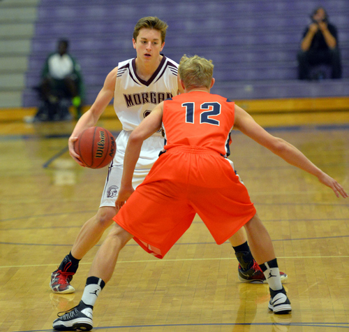 Keith Johnson | The Salt Lake Tribune

Morgan's Garren Miles (3) is guarded by Timpview's Luke Sagers (12)during the finals of the Riverton Holiday Tournament in Riverton, Utah, December 31, 2013.