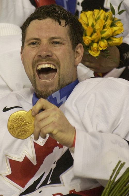 Trent Nelson  |  Tribune file photo

Canada's Owen Nolan celebrates his team's gold medal at the E Center.