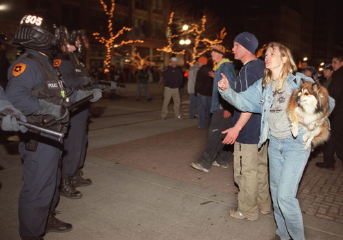 Emily Weirich  |  Tribune file photo

People argue with police officers dressed in riot gear at the corner of 300 South and Main Street in the early morning of Feb. 24, 2002.