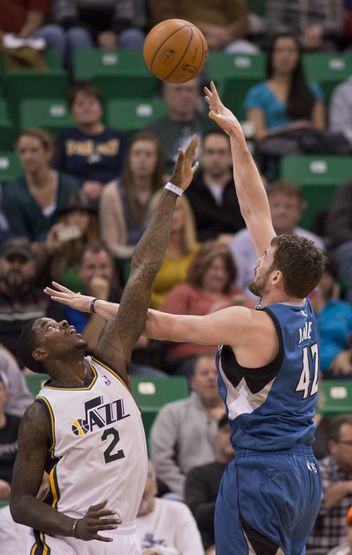 Lennie Mahler  |  The Salt Lake Tribune
Timberwolves forward Kevin Love scores over Jazz forward Marvin Williams in the first half of a game Saturday, Feb. 22, 2014, in Salt Lake City.