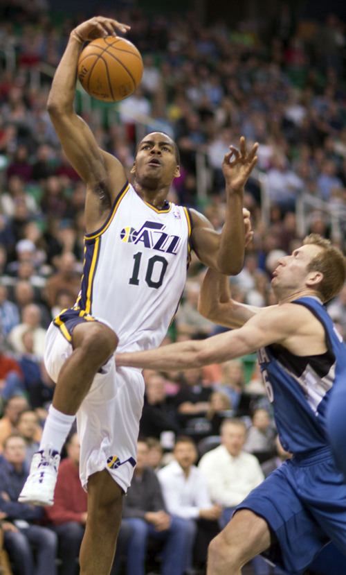 Lennie Mahler  |  The Salt Lake Tribune
Utah Jazz guard Alec Burks is fouled on his way to the basket by Timberwolves forward Robbie Hummel in the first half of a game Saturday, Feb. 22, 2014, in Salt Lake City.