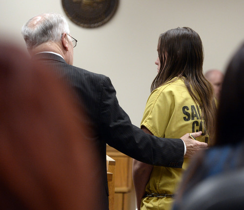 Al Hartmann  |  The Salt Lake Tribune 
17-year-old Meagan Grunwald, who has been charged as an adult in the shootings of two Utah deputies, makes her first appearance in Judge Darold McDade's in Provo, Utah, on Monday, February 24, 2014. She is seen her with her lawyer Dean Zabriskie.
