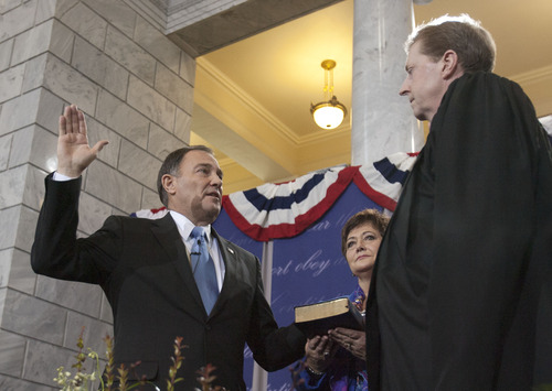 Steve Griffin | The Salt Lake Tribune

Utah first lady Jeanette Herbert holds the Bible for her husband, Utah Gov. Gary Herbert, as he is sworn as Utah's 17th governor by Chief Justice Matthew B. Durrant at the Utah State Capitol Monday January 7, 2013.