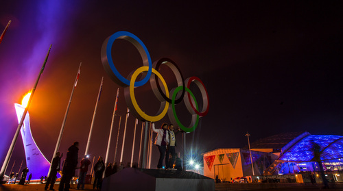 SOCHI, RUSSIA  - JANUARY 23:
A couple poses for pictures with the Olympic rings and flame during the Closing Ceremony of the 2014 Sochi Olympics at Fisht Olympic Stadium Sunday February 23, 2014. 
(Photo by Chris Detrick/The Salt Lake Tribune)