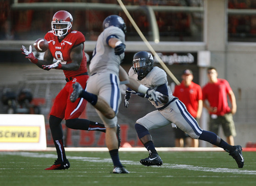 Scott Sommerdorf   |  The Salt Lake Tribune
Utah WR Anthony Denham catches a pass from QB Travis Wilson that he took 51 yards to the Utah State 2 yard line to set up the Utes first score. Utah took a quick 7-0 lead over USU early in the 1st period, Thursday, August 29, 2013.
