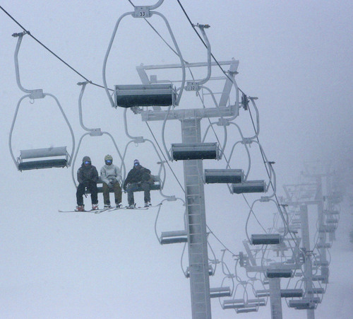 Steve Griffin  |  The Salt Lake Tribune
Skiers brave fog and snow as they ride the Skyline Double Chair ski lift during opening day at Eagle Point ski resort above Beaver, Utah Wednesday, December 15, 2010.