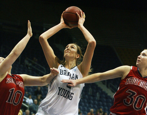 Kim Raff  |  The Salt Lake Tribune
BYU player (middle) Jennifer Hamson takes a shot as St. Mary's players (left) Kate Gaze and Amanda Arter defend during a game at the Marriott Center in Provo on January 31, 2013.