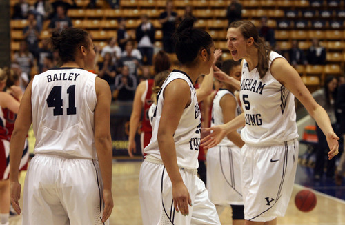 Kim Raff  |  The Salt Lake Tribune
BYU player (left) Morgan Bailey, Keilani Unga and Jennifer Hamson celebrate after defeating St. Mary's 66-58 at the Marriott Center in Provo on January 31, 2013.